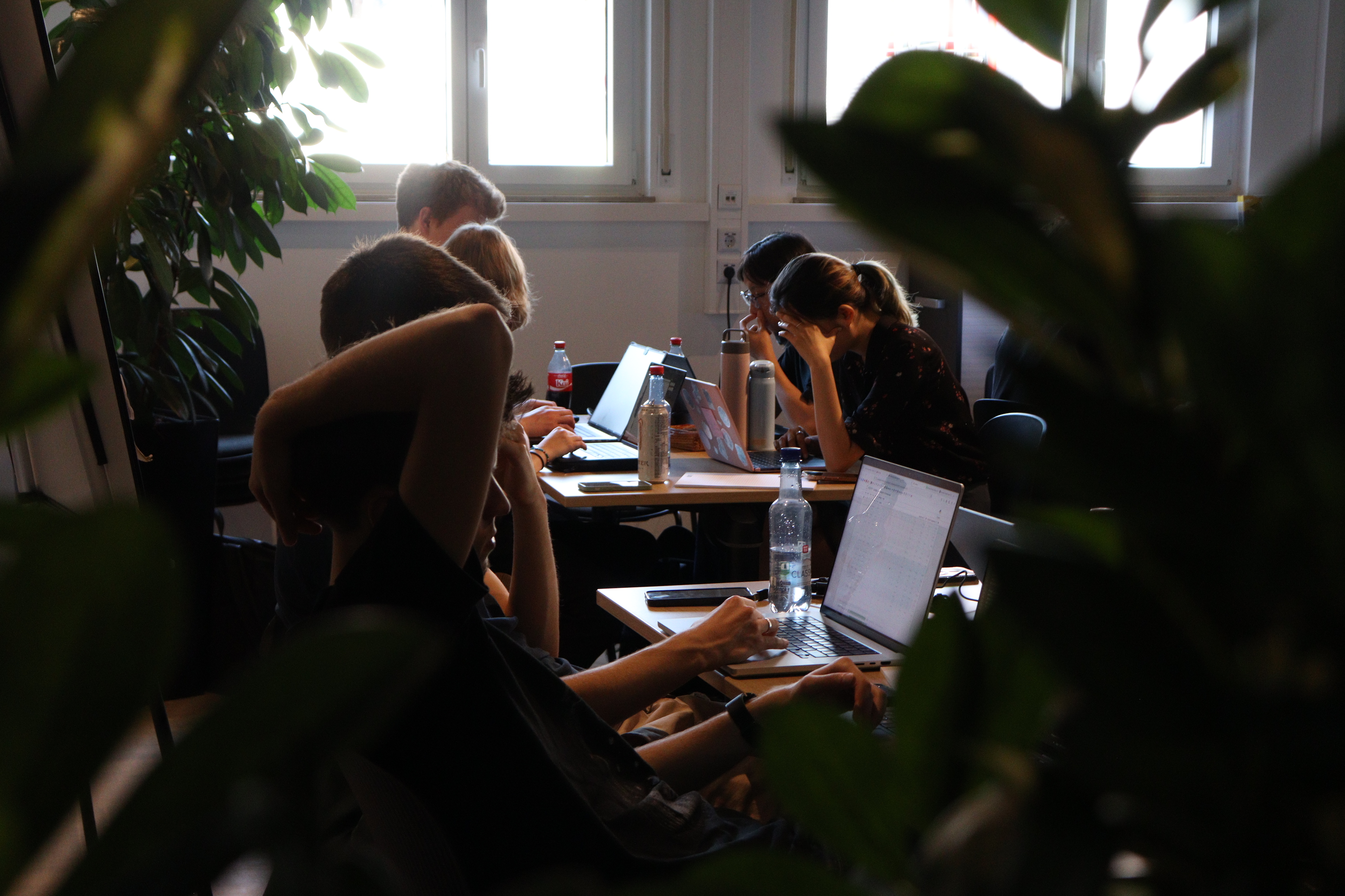 People coding at hackathon